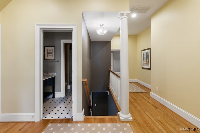 hallway with hardwood / wood-style flooring