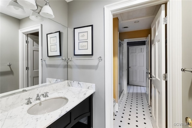 bathroom featuring vanity and toilet