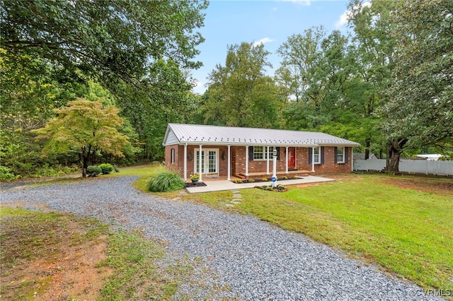 view of front of home with a front lawn and a porch