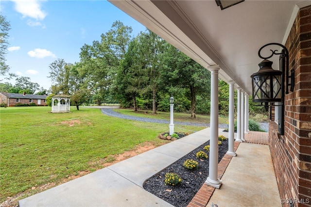 view of yard featuring covered porch