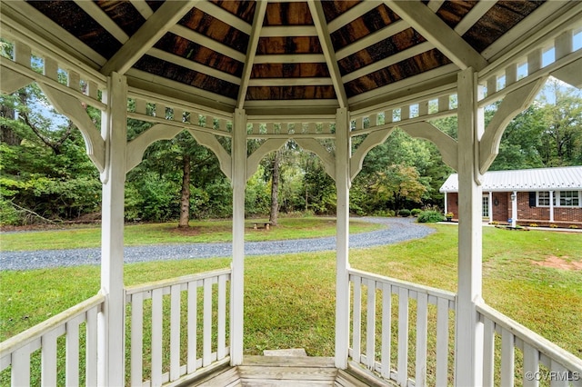 exterior space with vaulted ceiling