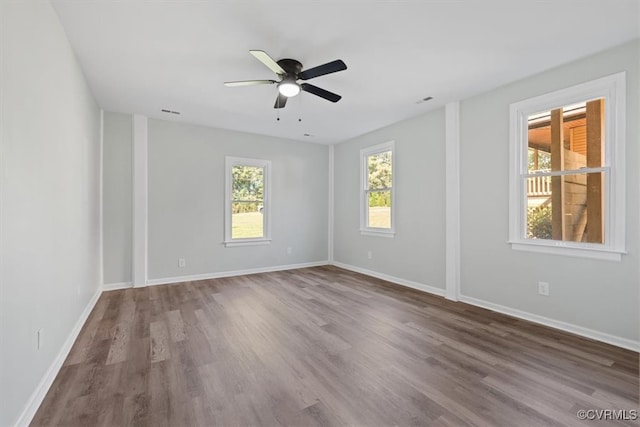 unfurnished room featuring hardwood / wood-style flooring and ceiling fan