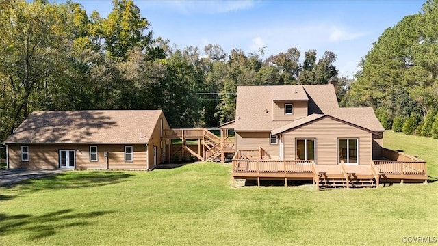 back of property featuring a yard and a wooden deck