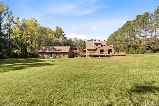 view of yard featuring a wooden deck