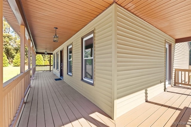 wooden terrace featuring a porch