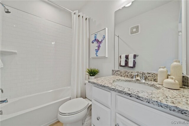 full bath featuring toilet, shower / tub combo, and vanity