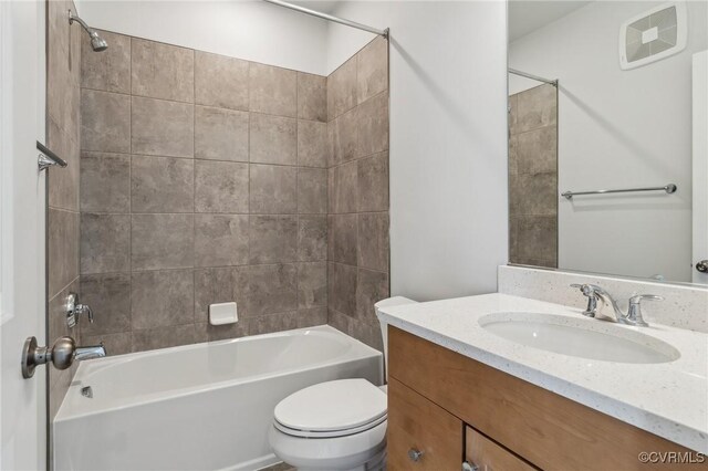 full bathroom featuring toilet, washtub / shower combination, visible vents, and vanity