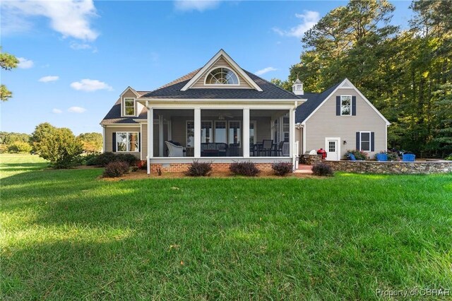330 River Village Dr, Weems, VA 22576 - back of house with a sunroom, a lawn, and roof with shingles