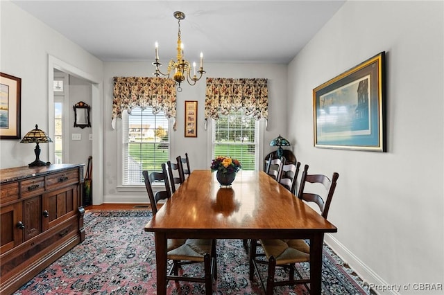 dining room featuring a notable chandelier and light hardwood / wood-style flooring