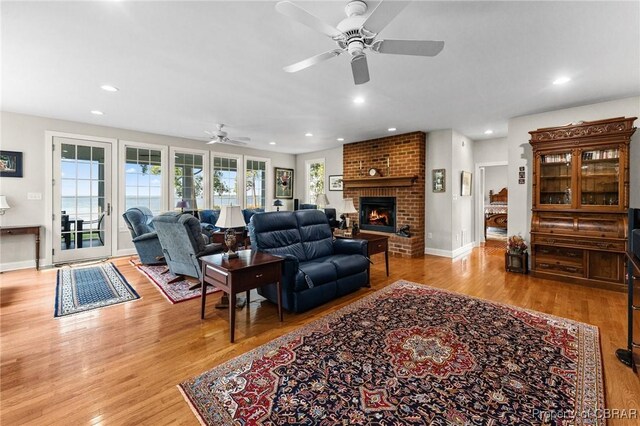 330 River Village Dr, Weems, VA 22576 - living room with a ceiling fan, recessed lighting, light wood-style floors, and a fireplace