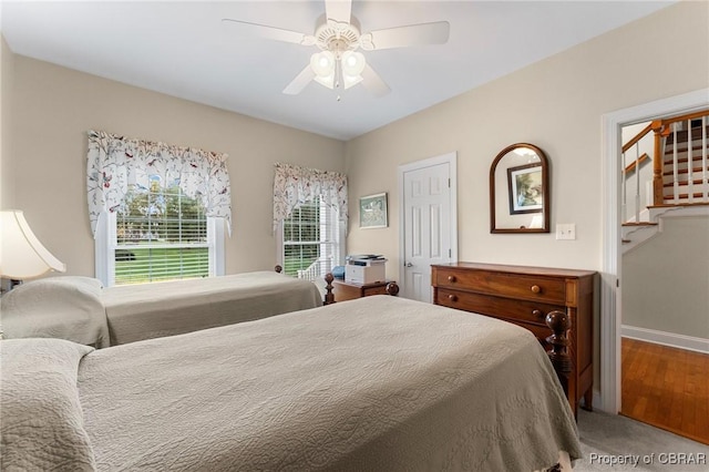 bedroom with ceiling fan and hardwood / wood-style floors