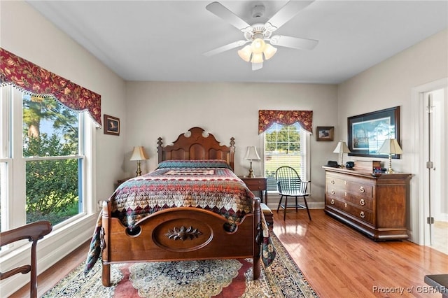 bedroom featuring ceiling fan and light hardwood / wood-style floors