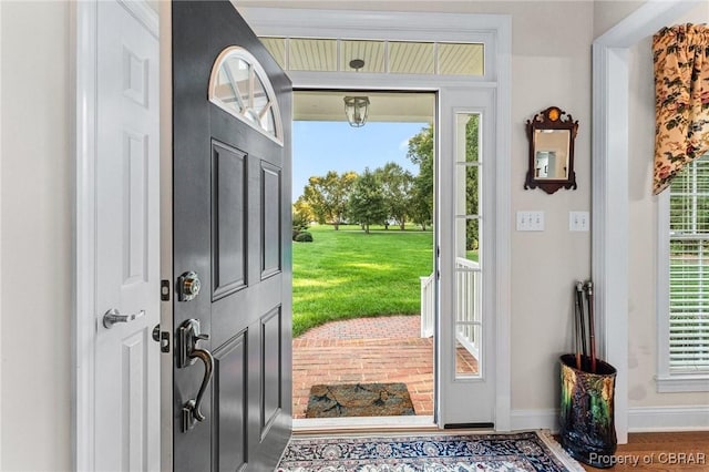 330 River Village Dr, Weems, VA 22576 - entrance foyer with baseboards and wood finished floors