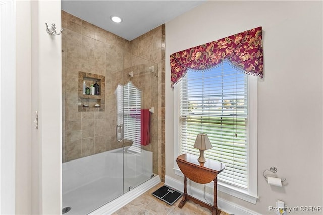 bathroom featuring tile patterned flooring and walk in shower