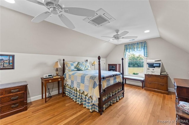 bedroom featuring ceiling fan, light hardwood / wood-style flooring, and vaulted ceiling