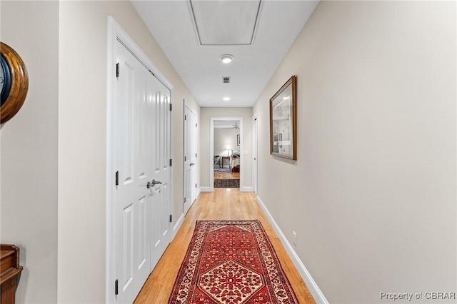 corridor featuring light hardwood / wood-style floors