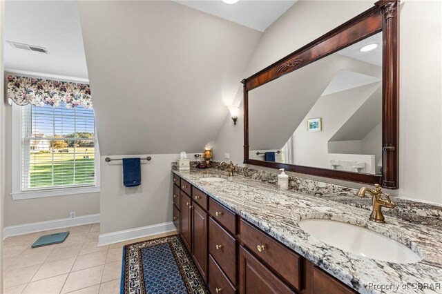 330 River Village Dr, Weems, VA 22576 - bathroom featuring double vanity, vaulted ceiling, and tile patterned flooring