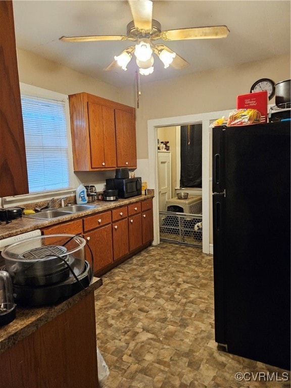 kitchen featuring sink, black appliances, and ceiling fan