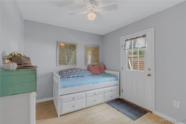 bedroom featuring light hardwood / wood-style floors and ceiling fan