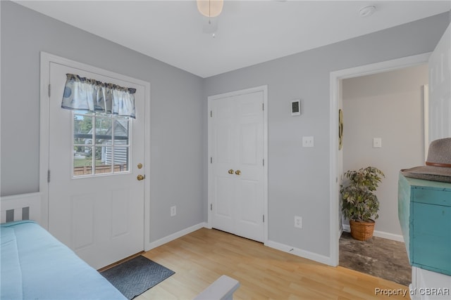 entrance foyer with ceiling fan and hardwood / wood-style floors