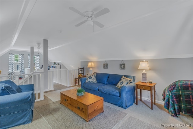 living room with ceiling fan, carpet flooring, and vaulted ceiling