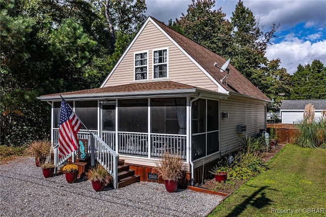 exterior space featuring a sunroom