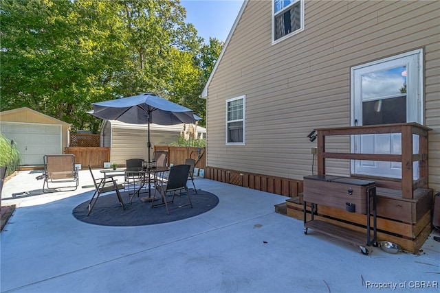 view of patio with an outbuilding