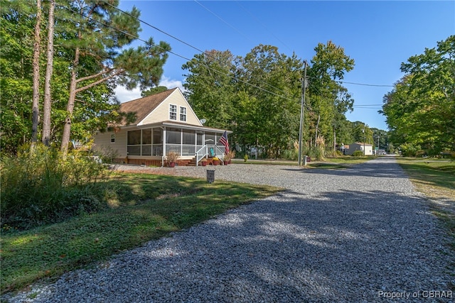 view of front of house featuring a sunroom