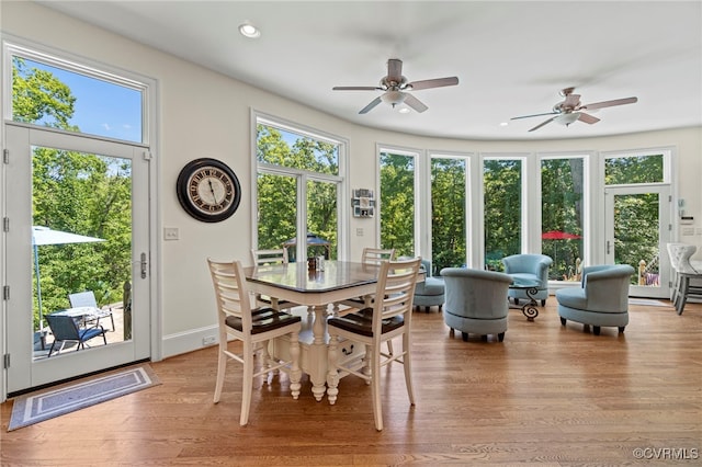 sunroom with a wealth of natural light and ceiling fan