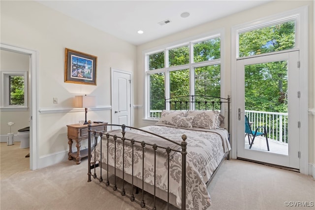 bedroom featuring access to outside and light colored carpet