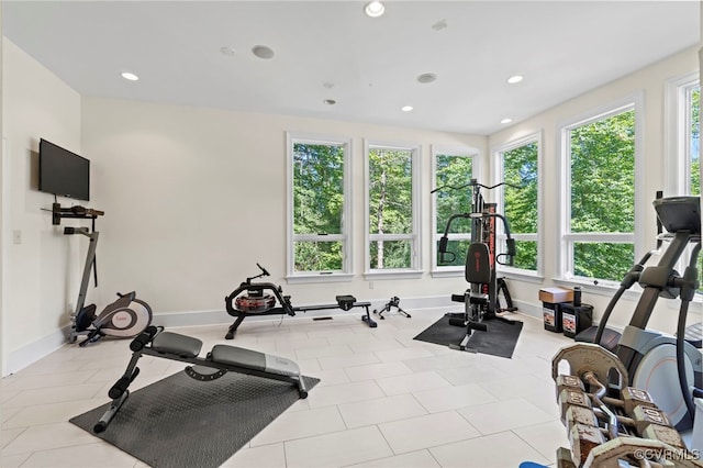 workout room featuring light tile patterned floors