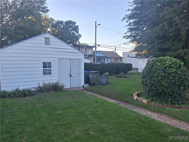 view of outdoor structure with a lawn