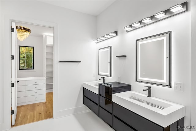 full bath featuring double vanity and a sink