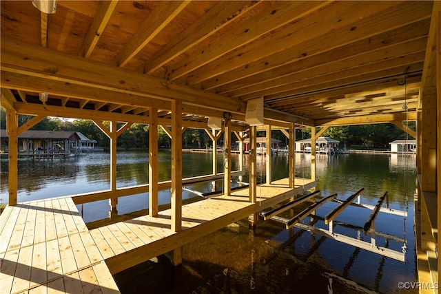 view of dock with a water view and boat lift