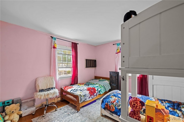 bedroom with hardwood / wood-style flooring