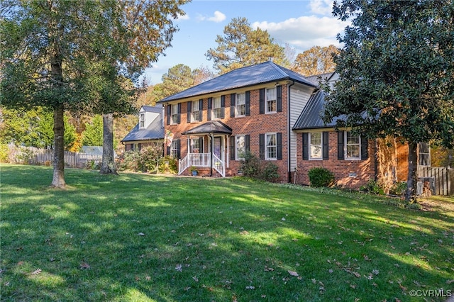 colonial home with a front yard