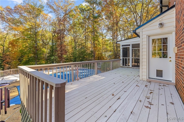 wooden terrace featuring a sunroom