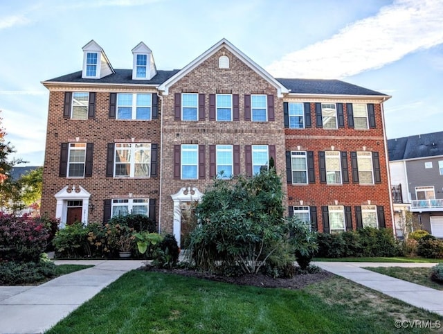 view of property with a front lawn