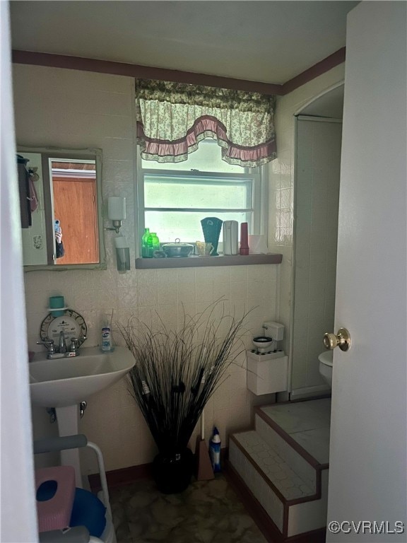 bathroom featuring sink and toilet