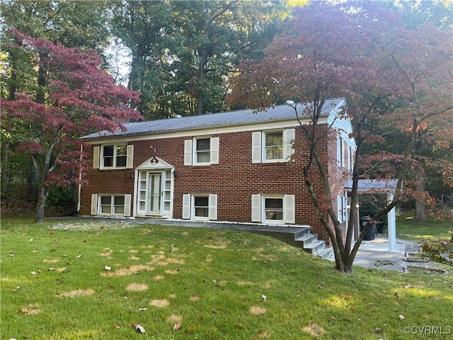 raised ranch featuring a front yard