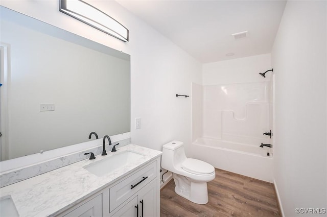 full bathroom with shower / bathtub combination, vanity, toilet, and hardwood / wood-style floors