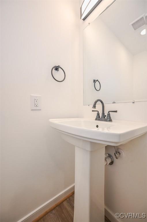 bathroom featuring hardwood / wood-style floors and sink