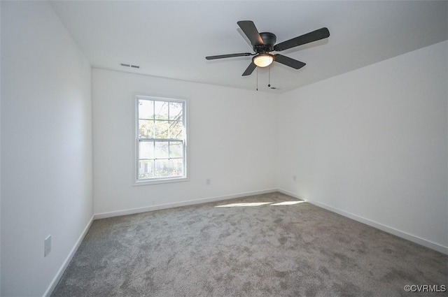 carpeted empty room with ceiling fan