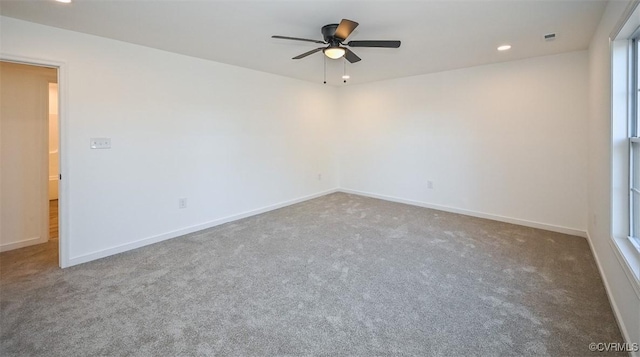 carpeted empty room with ceiling fan