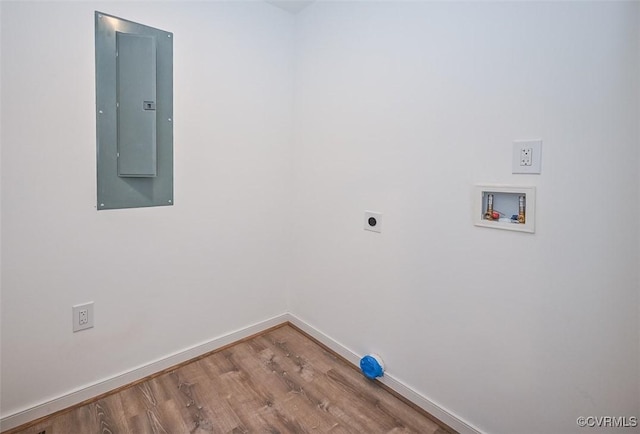 laundry area with hookup for a washing machine, wood-type flooring, electric dryer hookup, and electric panel