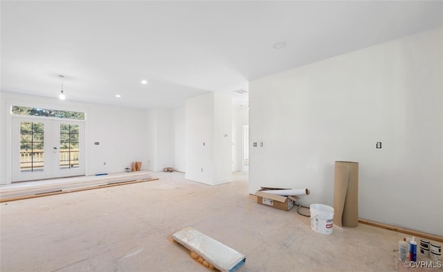 unfurnished room featuring french doors