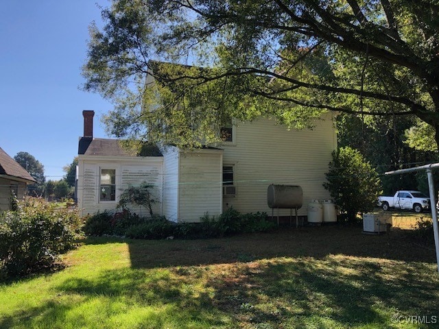 view of home's exterior featuring a yard