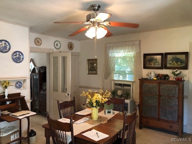 carpeted dining area featuring ceiling fan and cooling unit