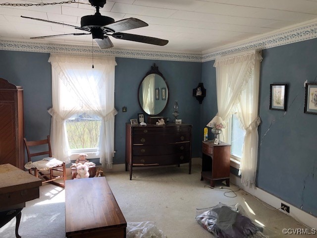 living area featuring carpet and ceiling fan