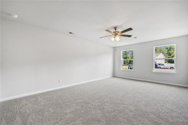 empty room with carpet floors and ceiling fan